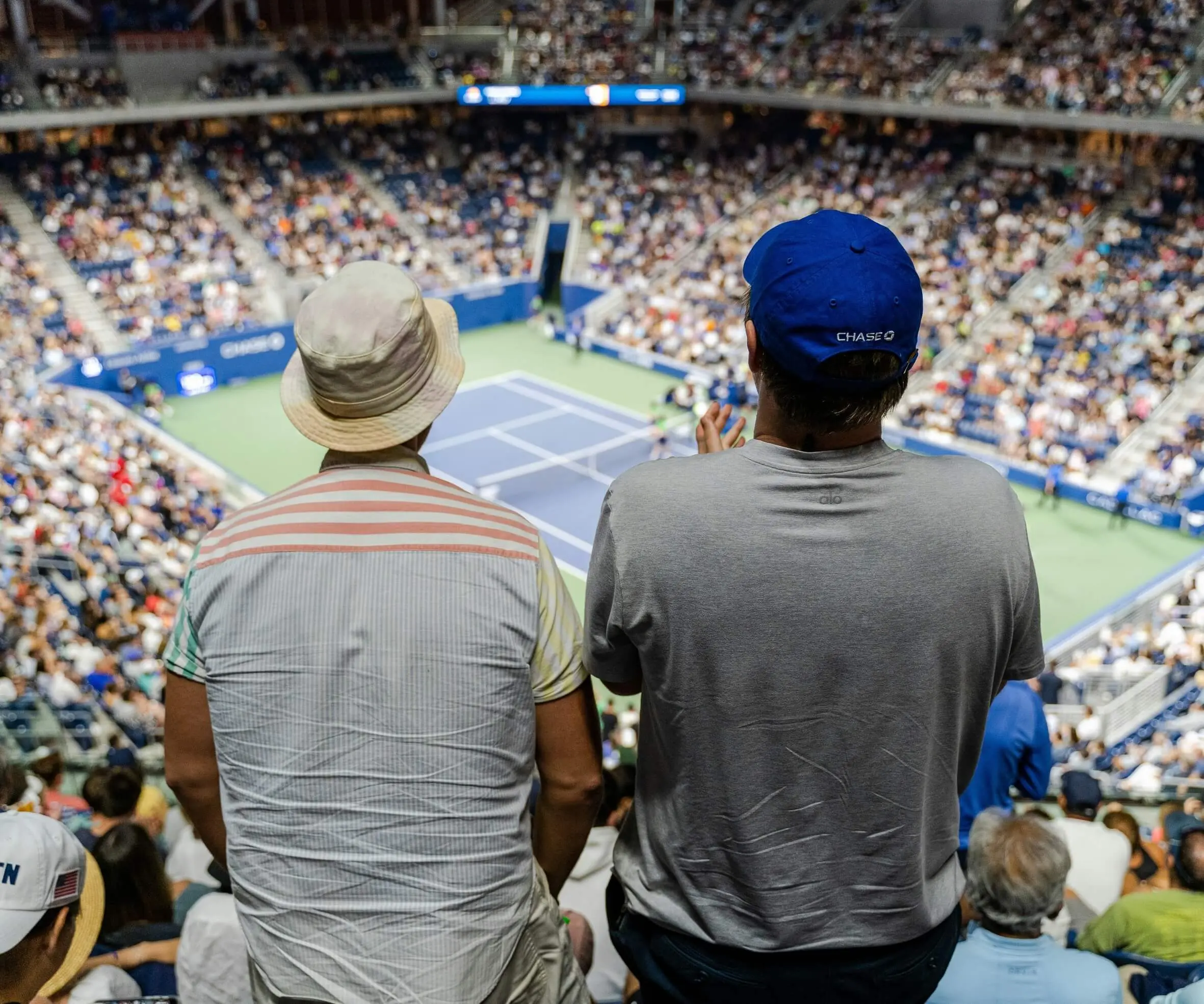 Two tennis fans at the stadium talking about riccardo leone's blog let's talk about tennis